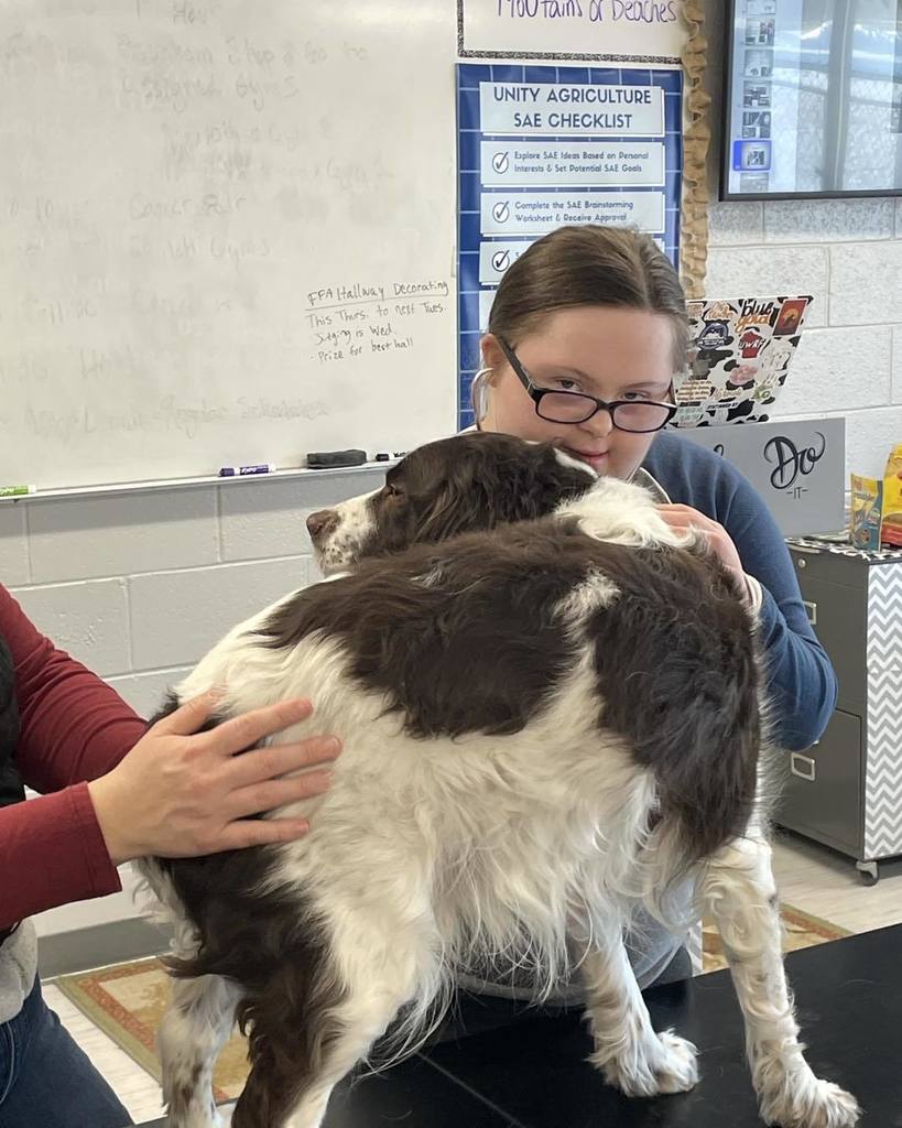 a picture of a student and a dog
