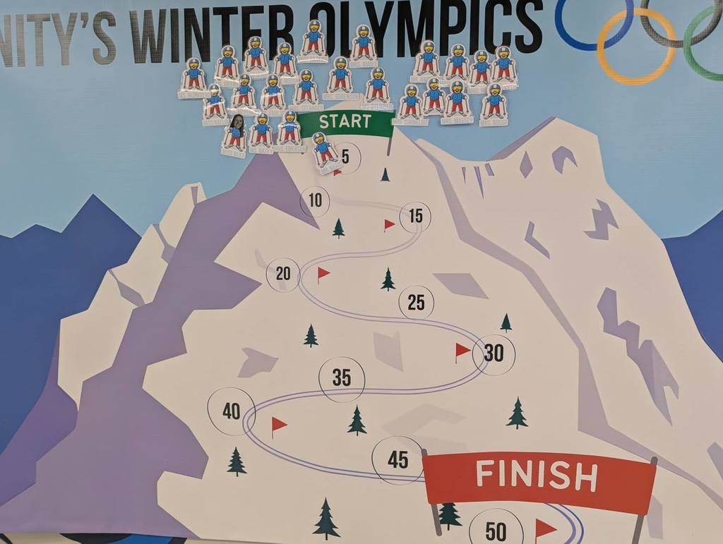 poster of Unity's Winter Olympics mountain with teacher skiiers
