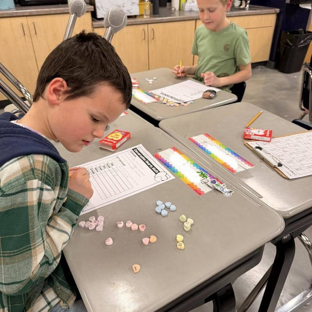 picture of student learning with candy hearts