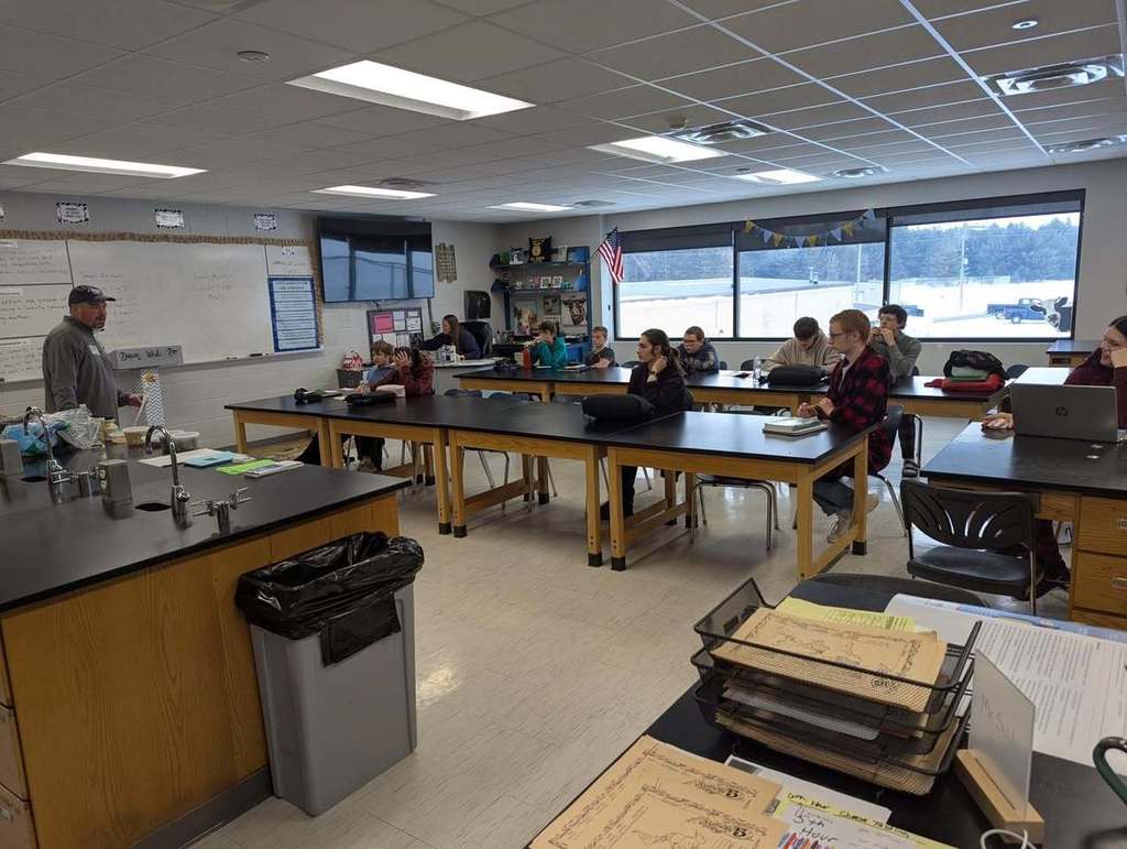 picture of students sitting at desks 