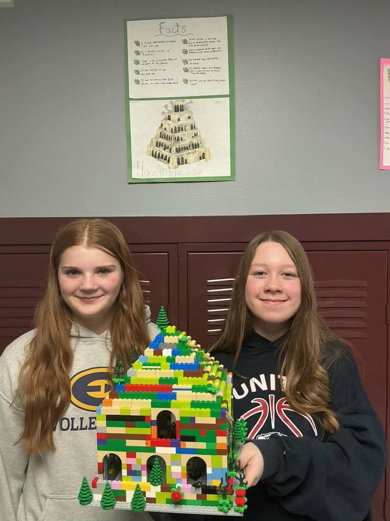 Two middle school students from Unity School District smiling and posing with their LEGO building.