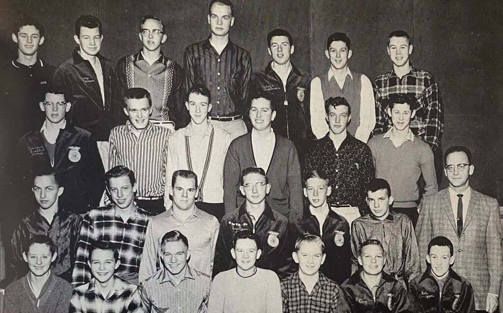 A black and white archive photograph from 1960 featuring a large group of young men and their instructor posing together in rows. Several of the students are wearing Future Farmers of America (FFA) jackets.