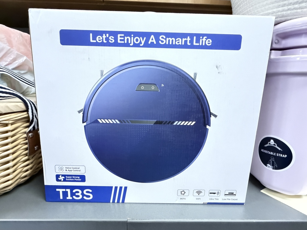 Boxed blue smart robot vacuum cleaner displaying the slogan "Let's Enjoy A Smart Life" and model T13S.