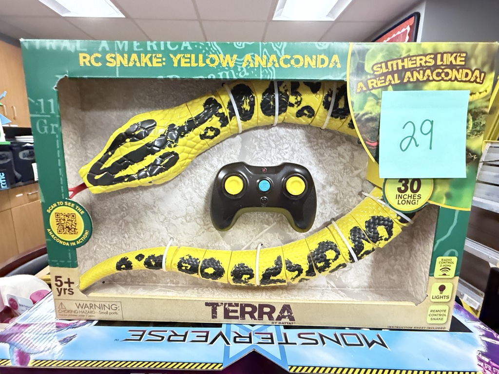 A boxed Terra RC Snake Yellow Anaconda remote-controlled toy snake with a sticker featuring the number 29 on the package.