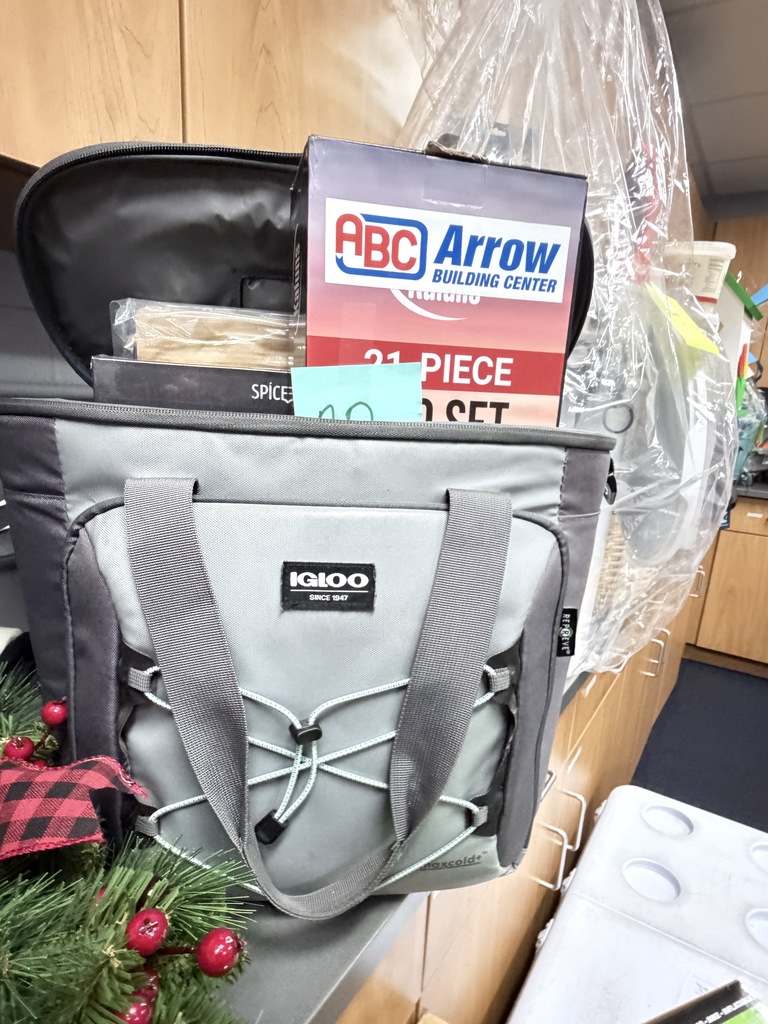 A soft-sided Igloo cooler bag packed with items including an ABC Arrow Building Center 21-piece set box.