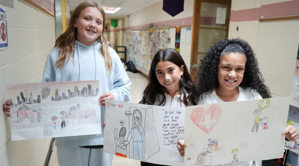 students holding projects for novel study