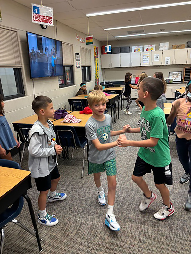 Three students dancing