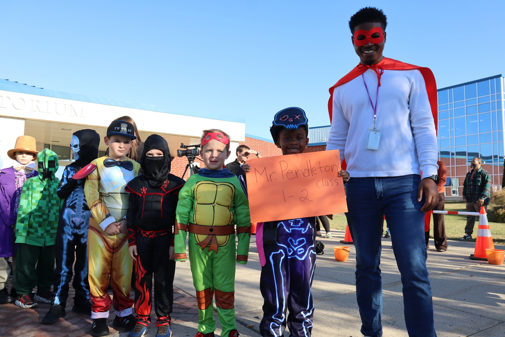 Students and their teacher posing for a photo.
