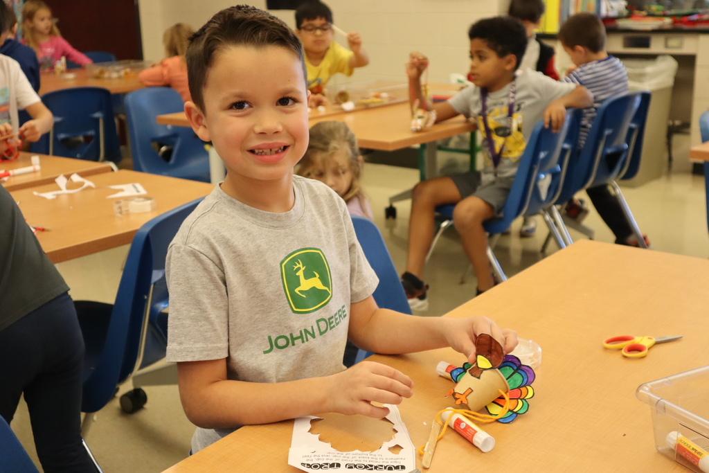 Student working on his turkey marionette