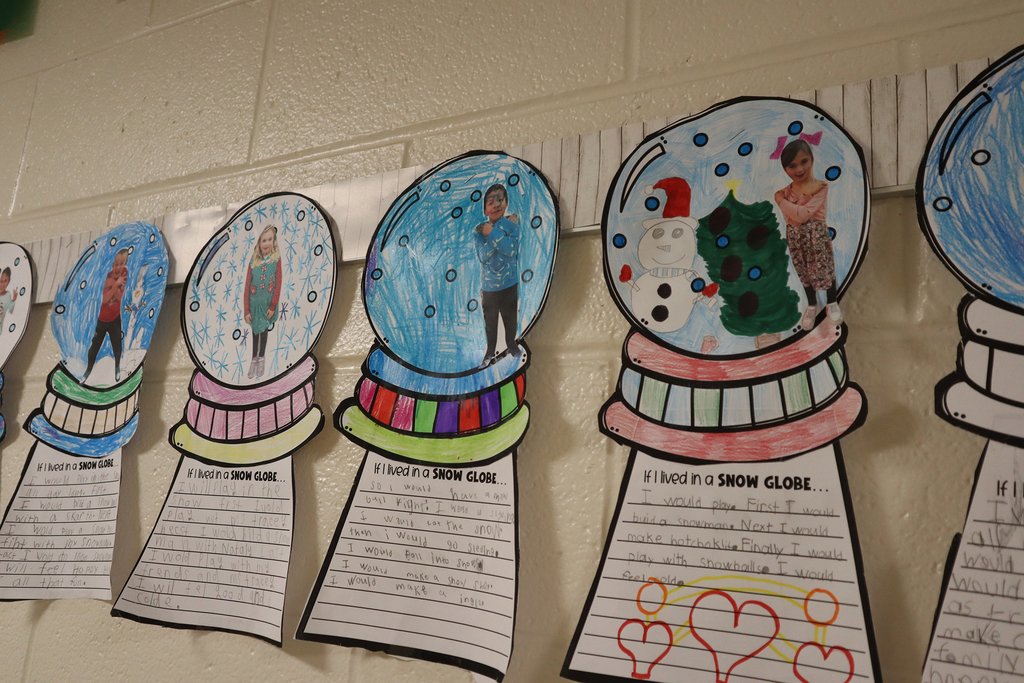 Snowglobes students made hanging in the hallway with pictures of themselves inside