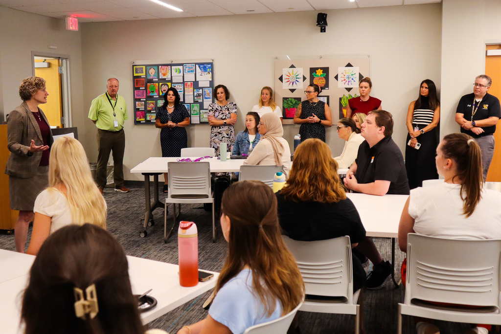 Dr. Elliott delivering her welcome message to a group of new teachers
