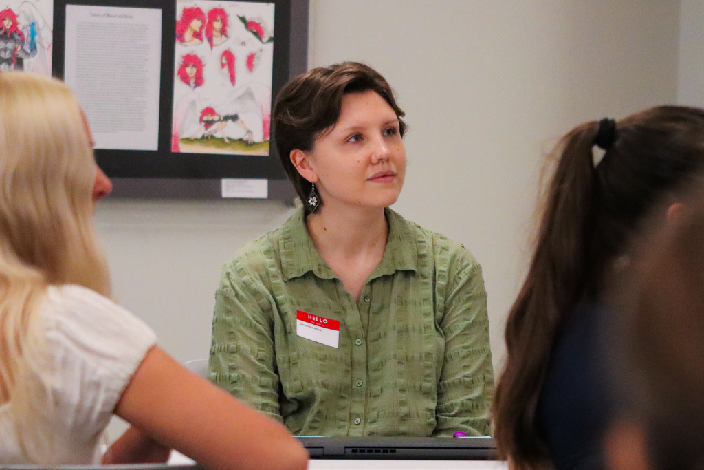 New teacher listening to Dr. Elliott's welcome message