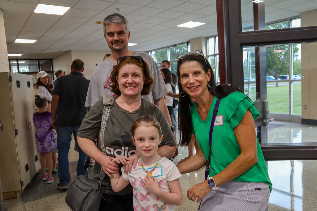 Dr. Criss smiling with a family