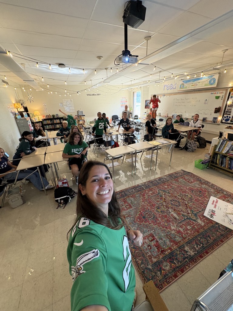 UMM students pose for a photo wearing their Eagles gear