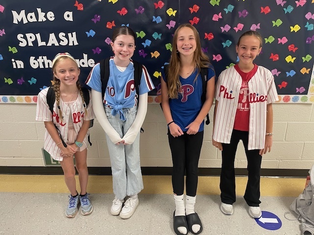 Students pose in Phillies gear