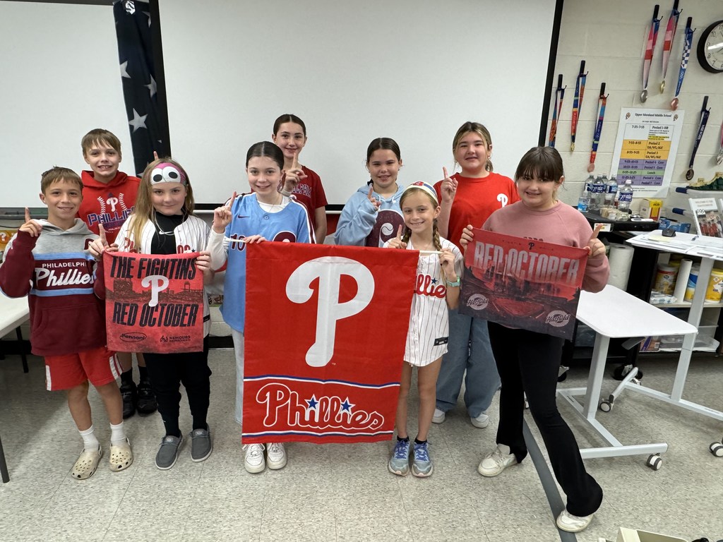 Students pose in Phillies gear