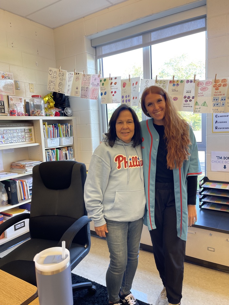 Staff pose in Phillies gear