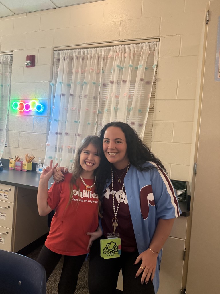 Students and staff pose in Phillies gear