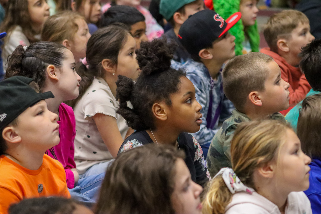 Students watch authors present