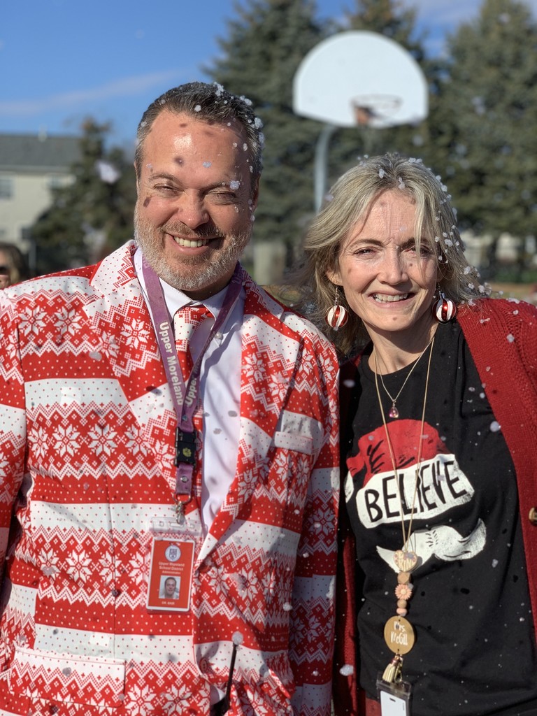Dr. Bair posing for a photo with staff member on the Snow Day
