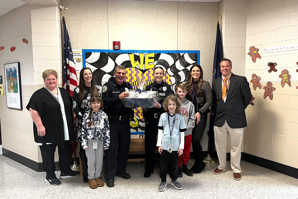 UMIS staff and students standing with UMPD officers