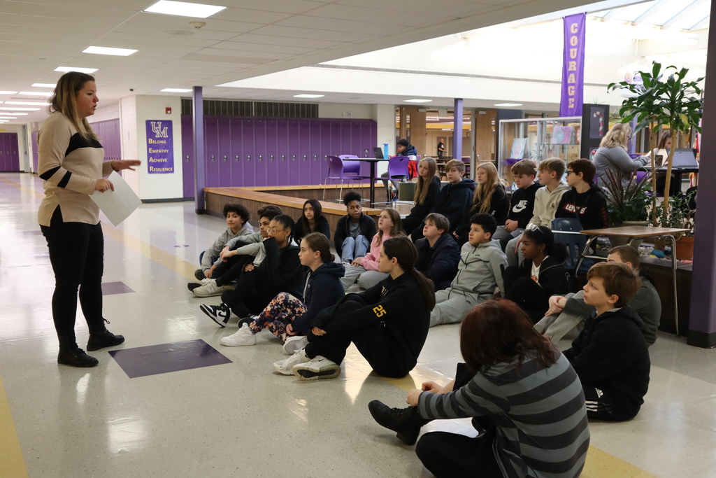 Mrs. Roessler speaks to the class about the lesson