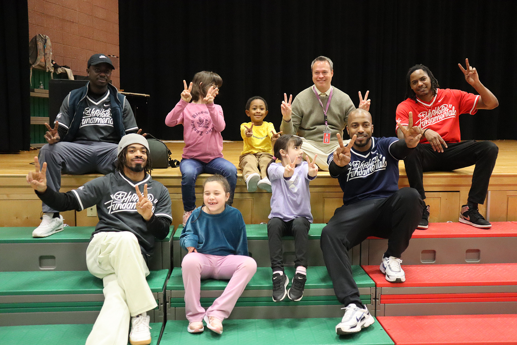 HHF smiling with students and Dr. Bair