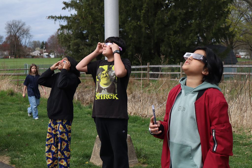 Students and staff watch the total eclipse