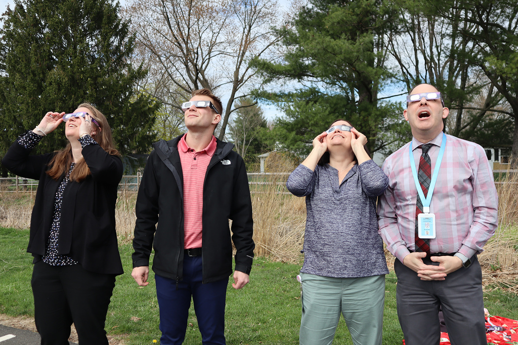Students and staff watch the total eclipse