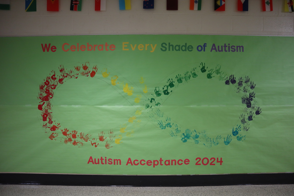 Rainbow infinity mural made by students and staff handprints