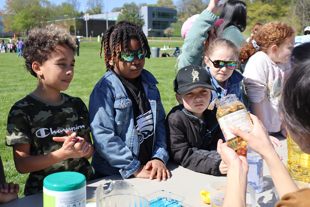 2nd-graders listening at science station