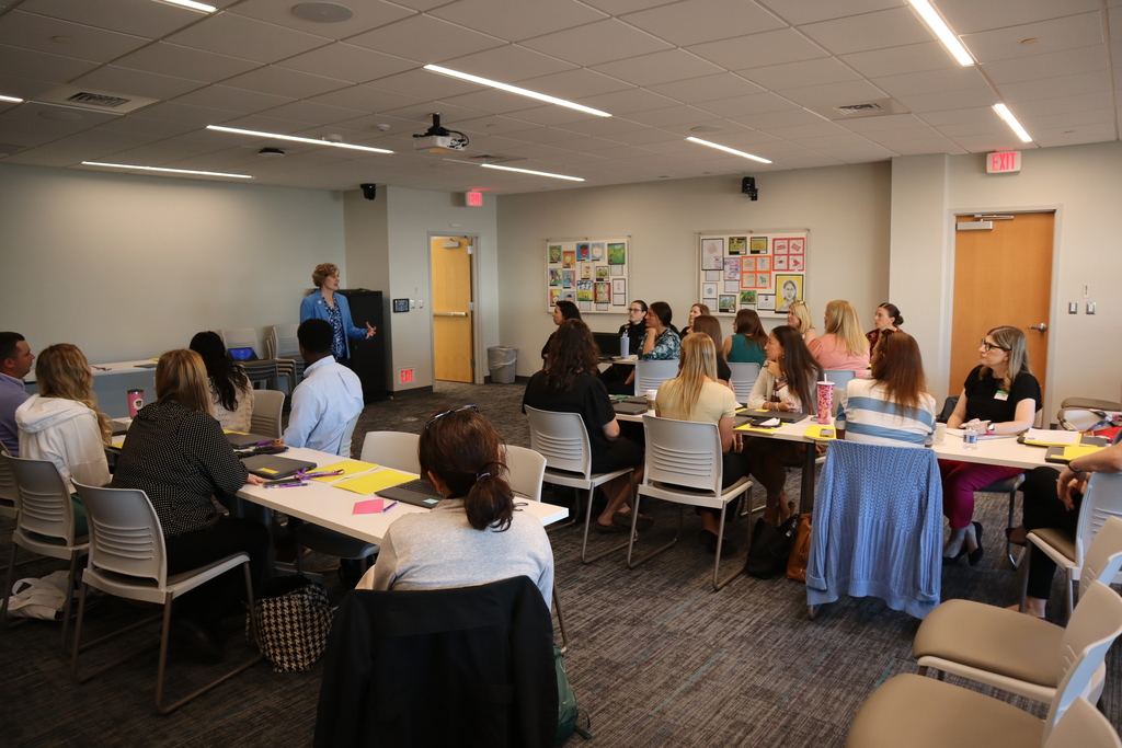 Dr. Elliott speaking to group of new teachers.