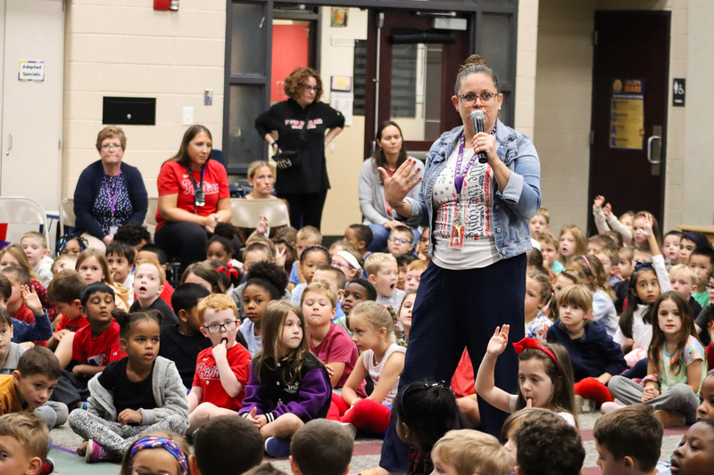 UMPS principal speaks to group of students during assembly