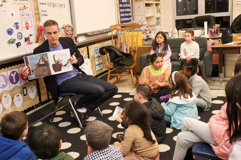 * Mr. Synnestvedt reads to a large group of students