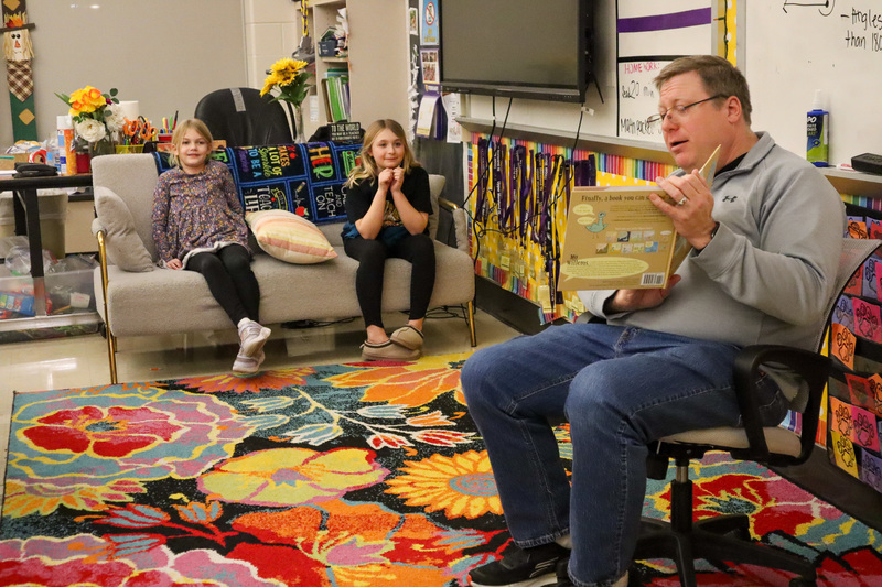 * Mr. Rounds reads to two students