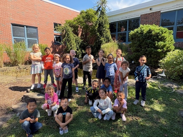 Students smiling in Learning Habitat