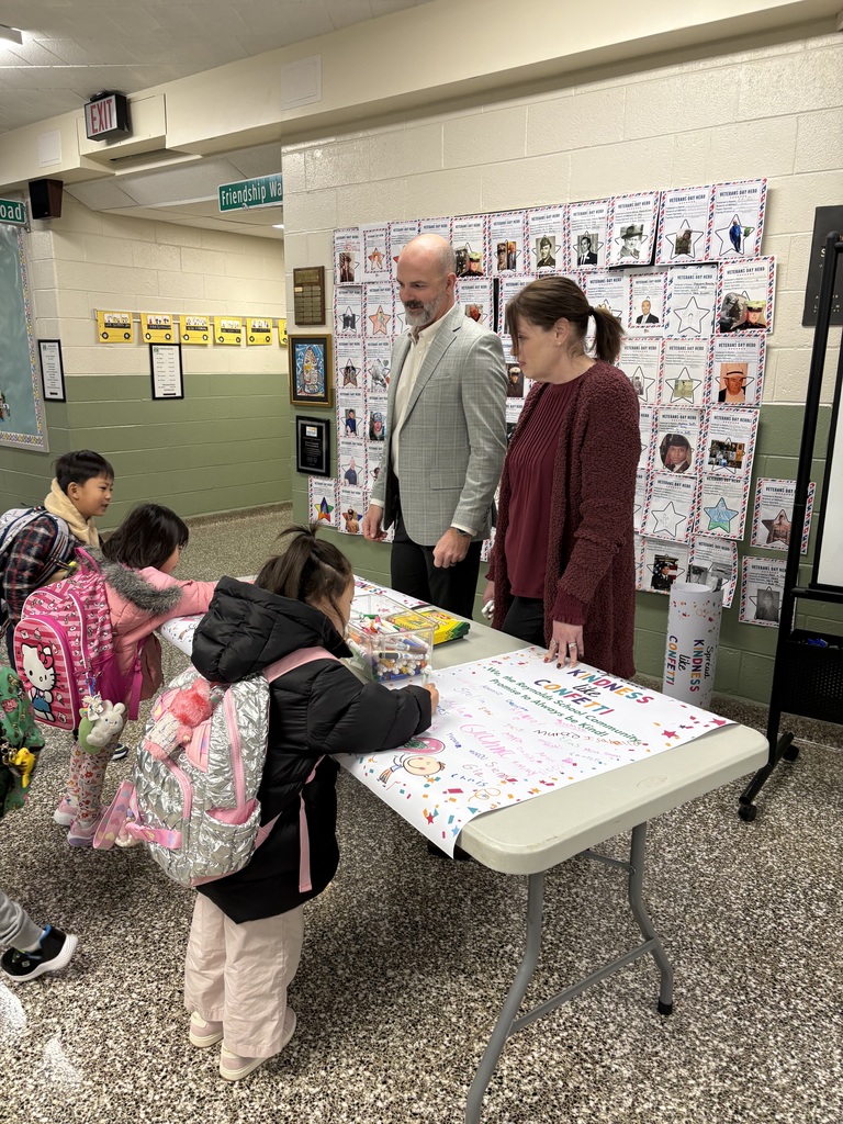 Students signing kindness posters