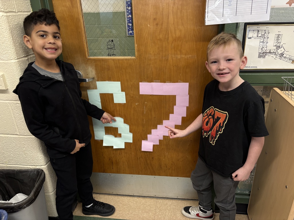 Students pointing to 6-7 post-its