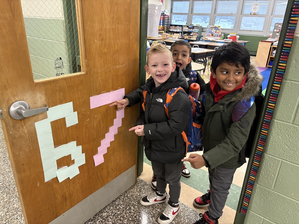 Students pointing to 6-7 post-its