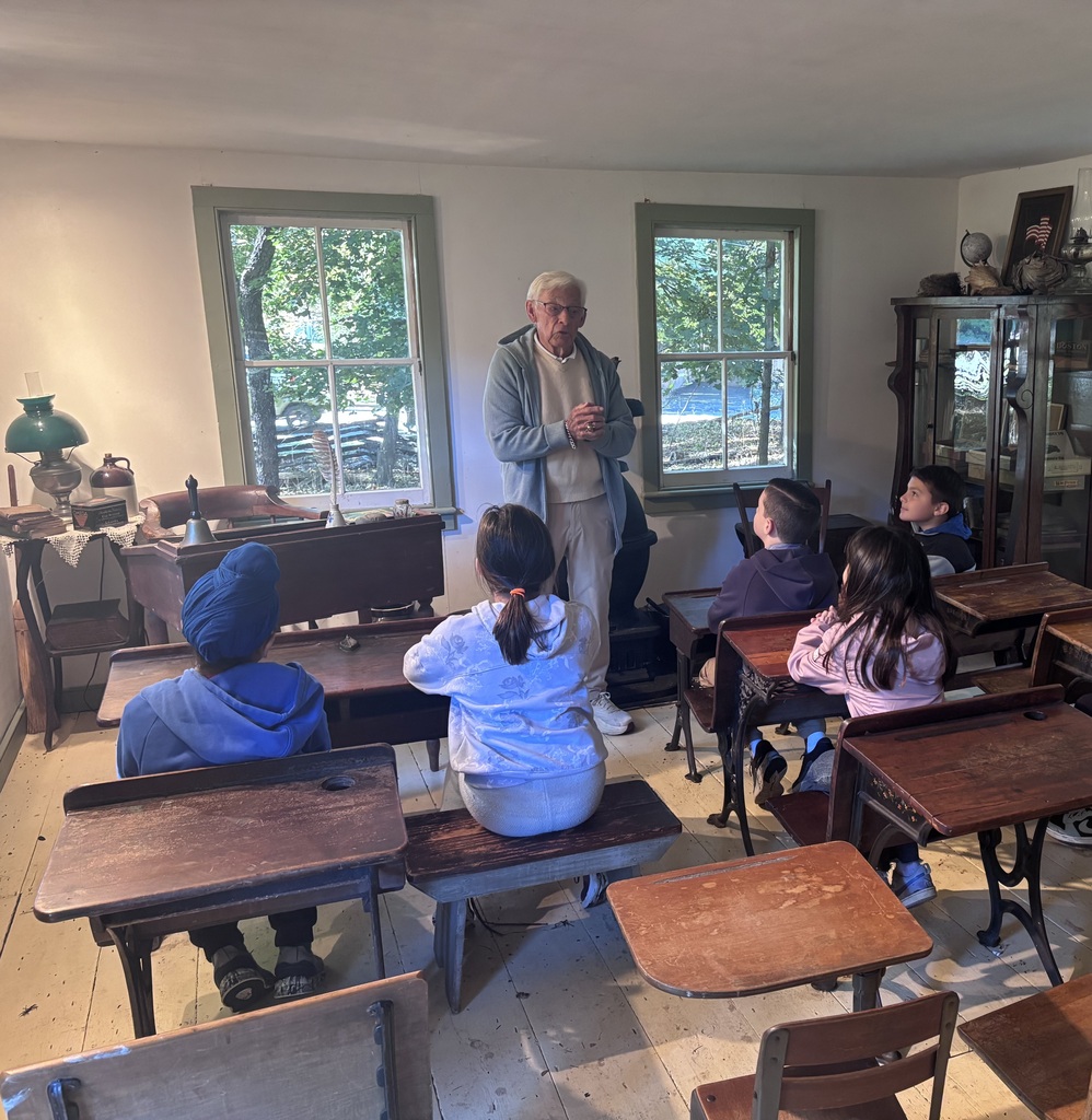 Students learn in a historic classroom.