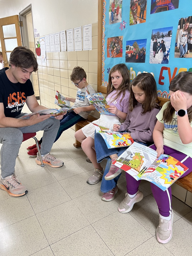 high school student and second graders