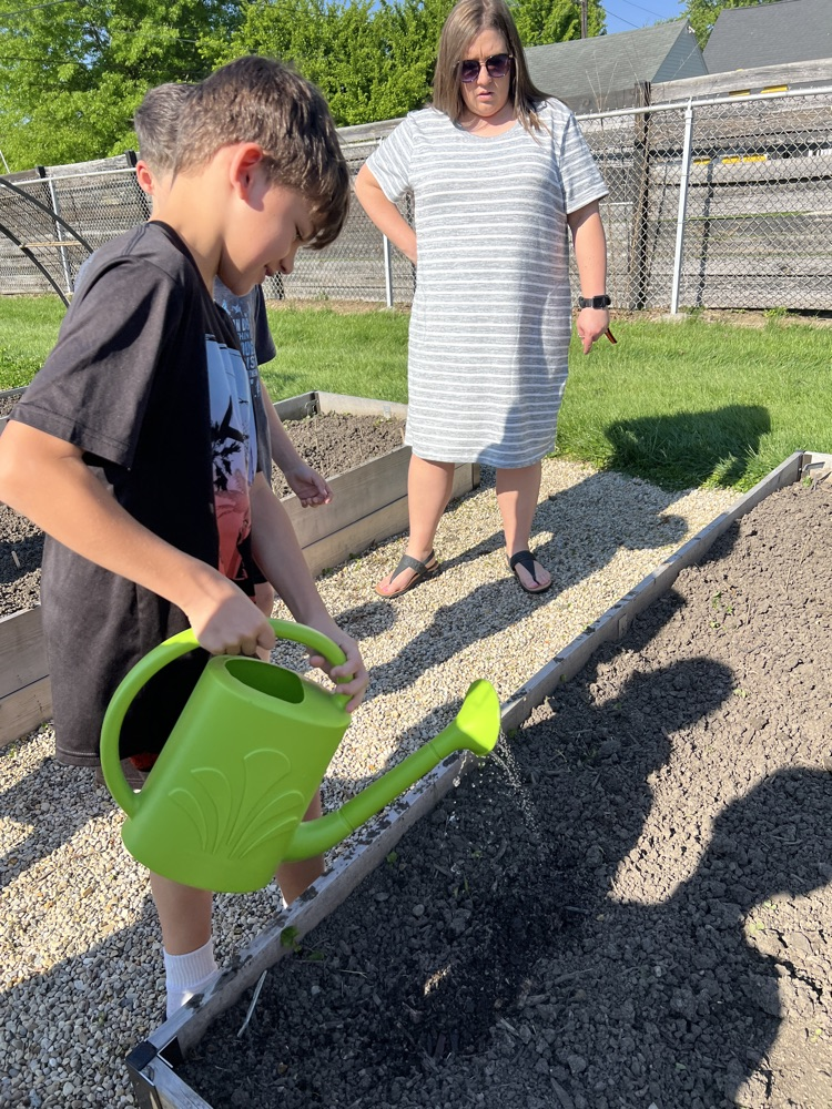student watering