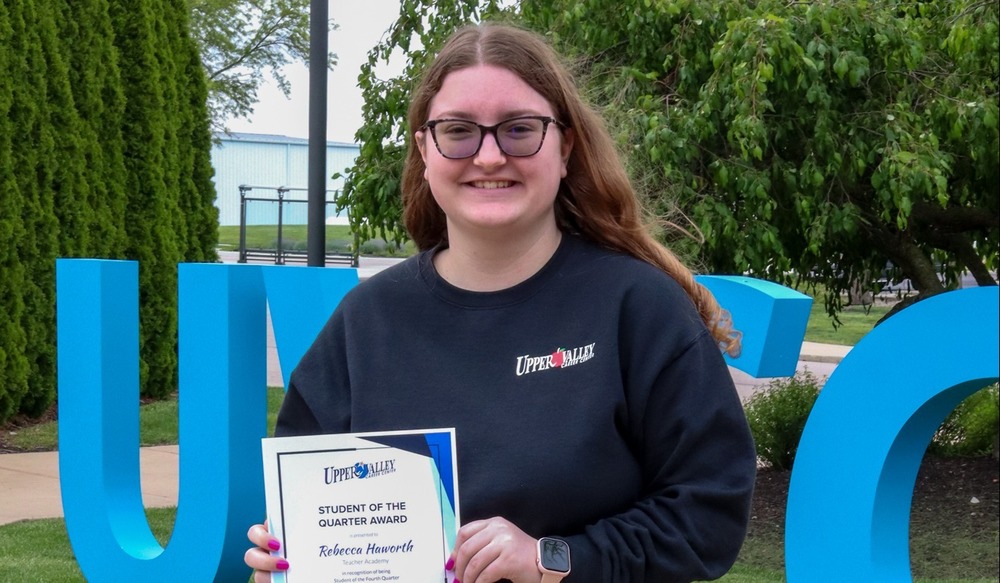 image of student with their award