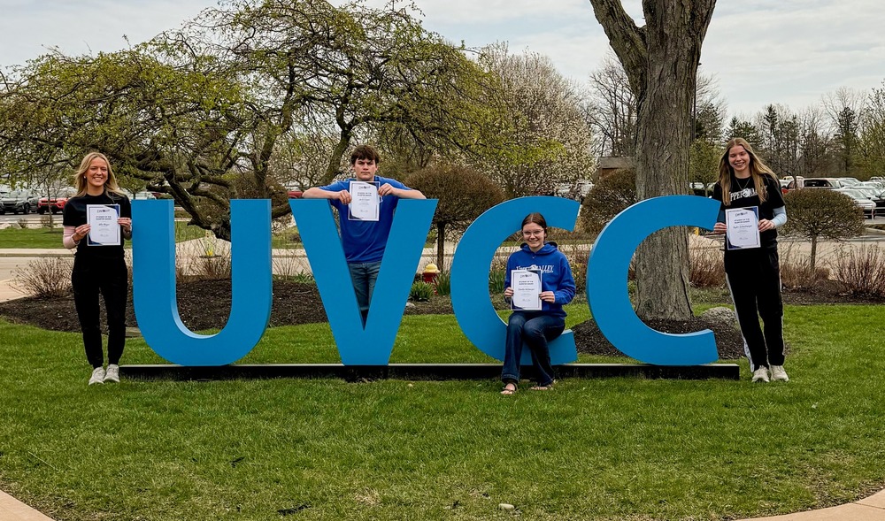 students of the quarter in front of UVCC letters