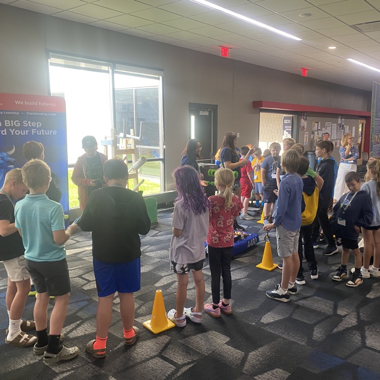 young students learning about robots