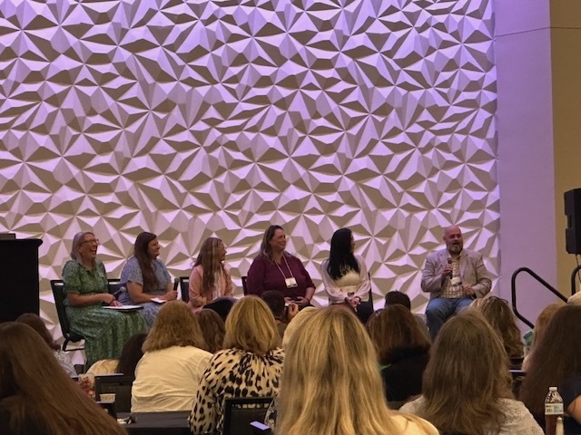 Mr. Brandon Kelley is pictured on the right side of the photo sitting down as part of panel discussing his extremely important role in the school system and how to do the best job.
