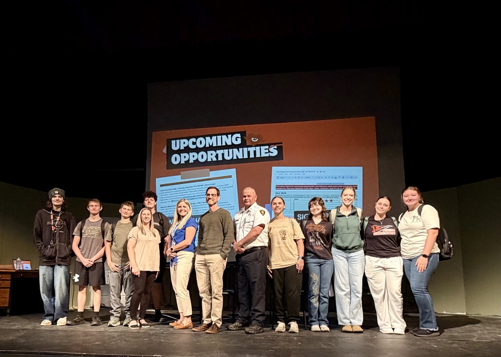 Picture of local partners meetings with WVWC students discussing volunteer opportunities