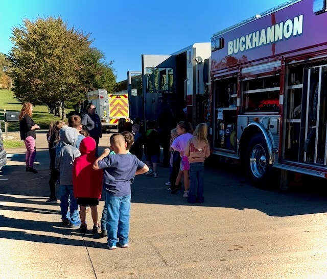 Students stand in like to explore a fire truck at Union Elementary School