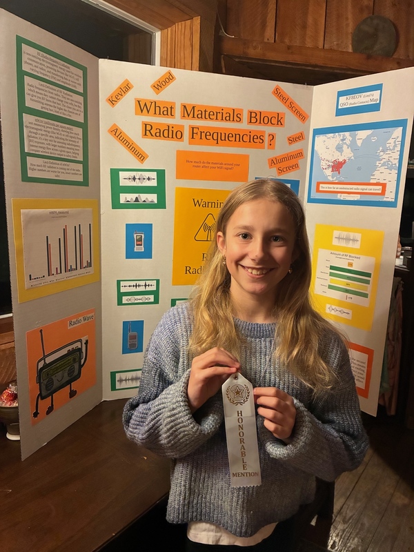 Liezle with her state science fair project that earned honorable mention.