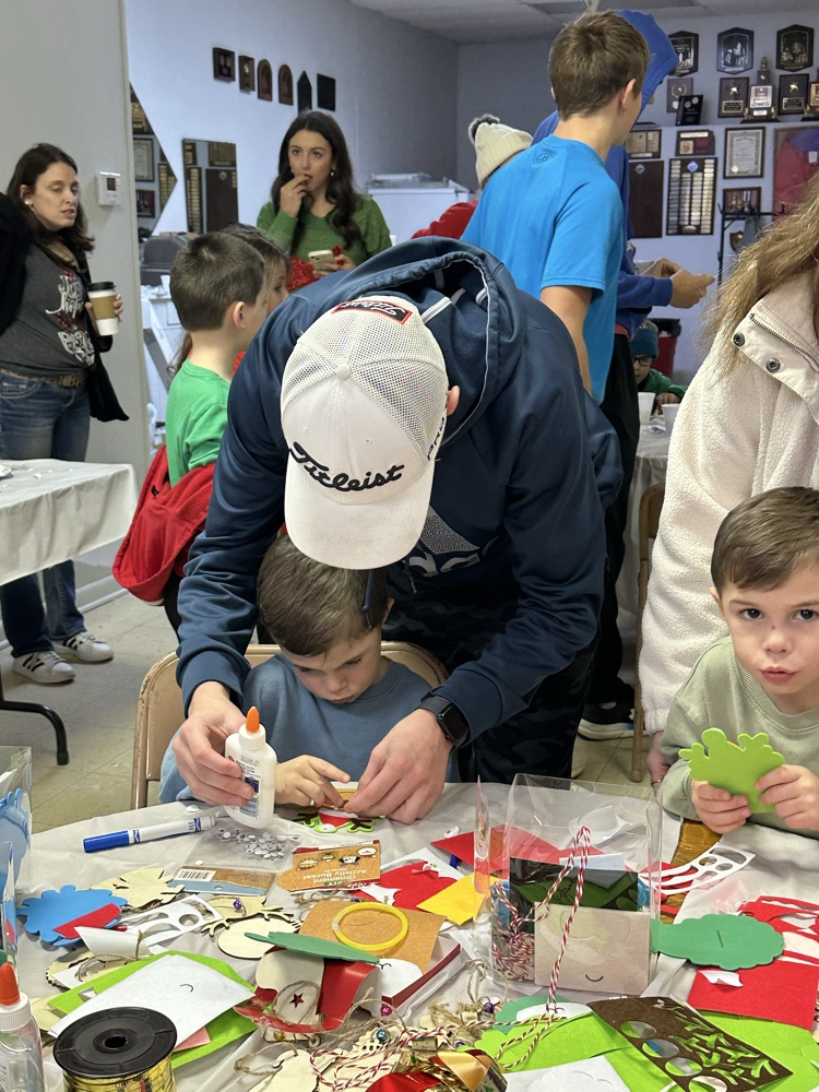 Dean Dragastin helps his brothers, Leo and Louie make some ornaments.